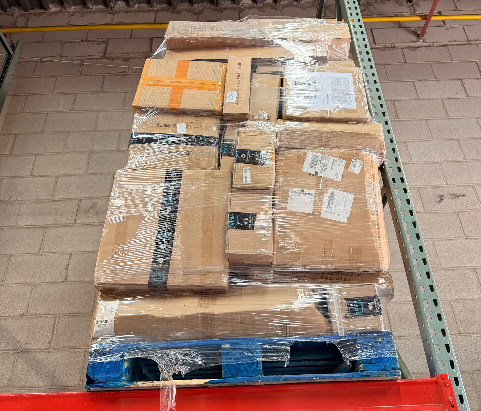 Wrapped liquidation pallet in warehouse storage
